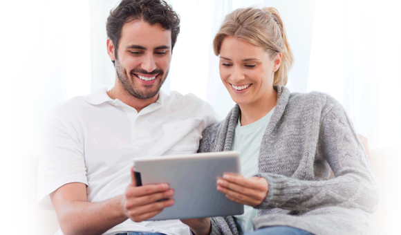 couple looking at tablet