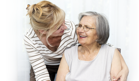 woman caring for older woman