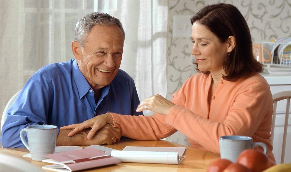 woman-and-older-man-sitting-at-a-table